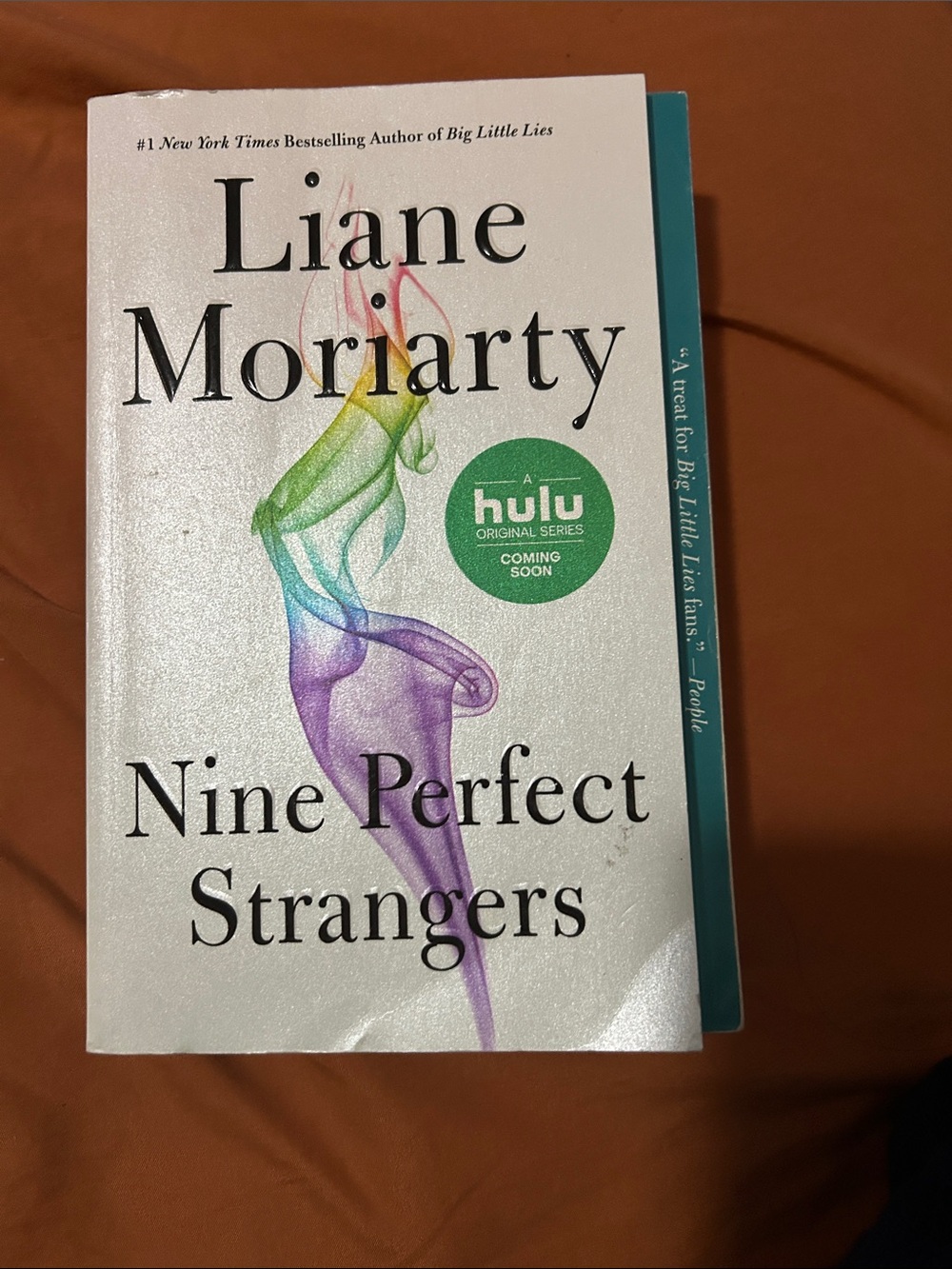 Liane Moriarty Nine Perfect Strangers - White Cover with Rainbow Smoke